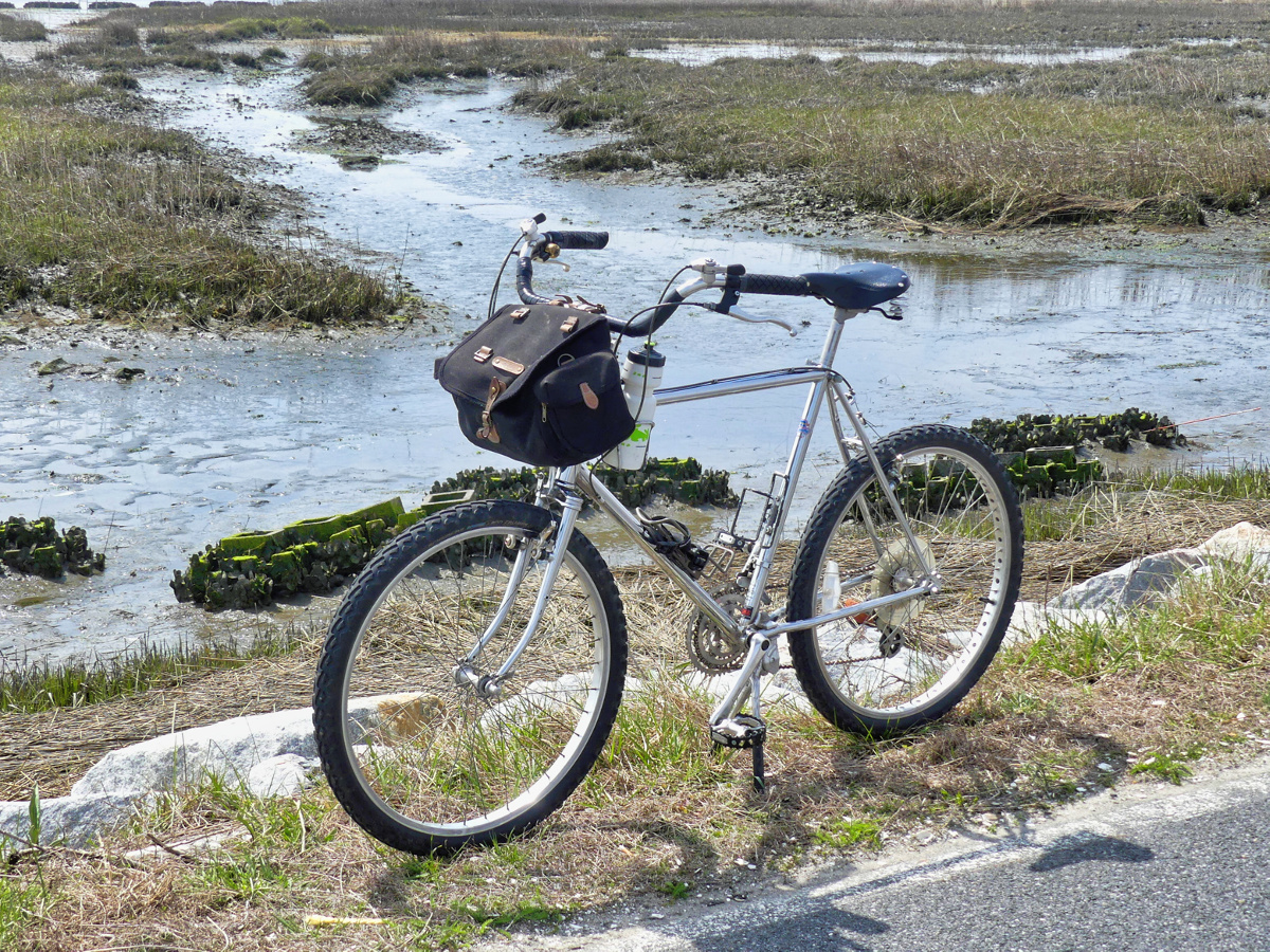  Vintage Mountain bike on the side of the road adjacent to a cove with oyster castles in the mid ground